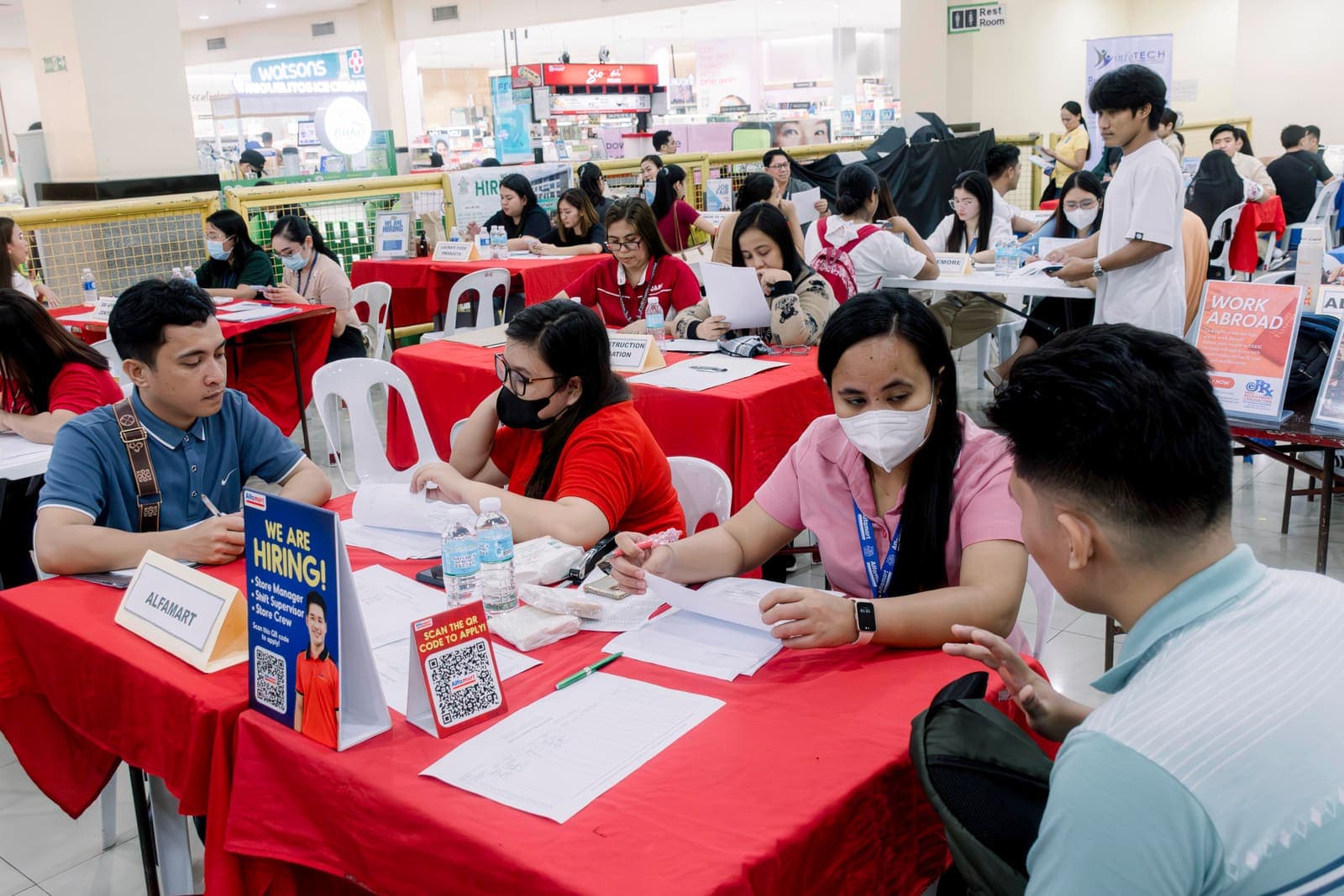 Jobseekers being interviewed at a PESO job fair